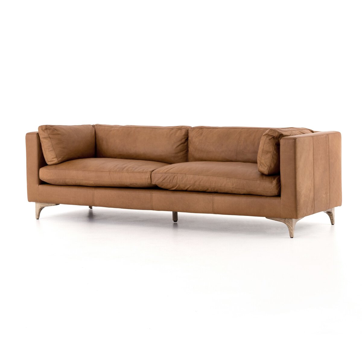 The Beckwith Sofa combines mid-century modern style with a solid ash frame and soft, top-grain leather upholstery in Camel.