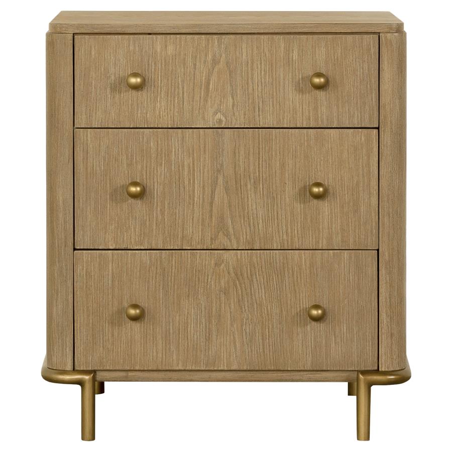 The 3 drawer Arini Nightstand in solid wood with sand wash finish, metal accents, felt-lined top drawers and dual USB ports.